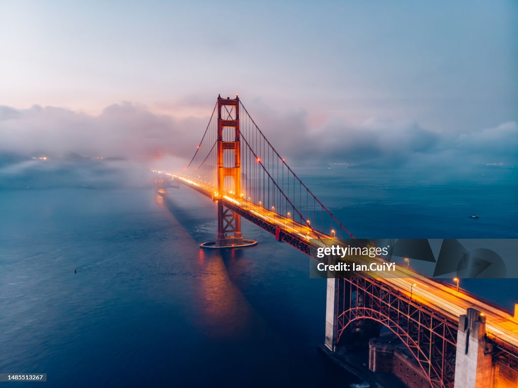 Red Golden Gate Bridge under a foggy sky (Dusk)