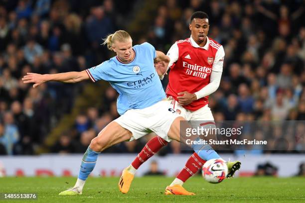 Erling Haaland of Manchester City holds off Gabriel of Arsenal during the Premier League match between Manchester City and Arsenal FC at Etihad...
