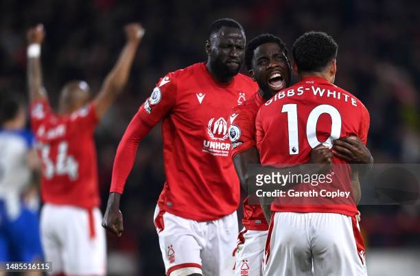 Orel Mangala celebrates with Morgan Gibbs-White and Cheikhou Kouyate of Nottingham Forest following the Premier League match between Nottingham...