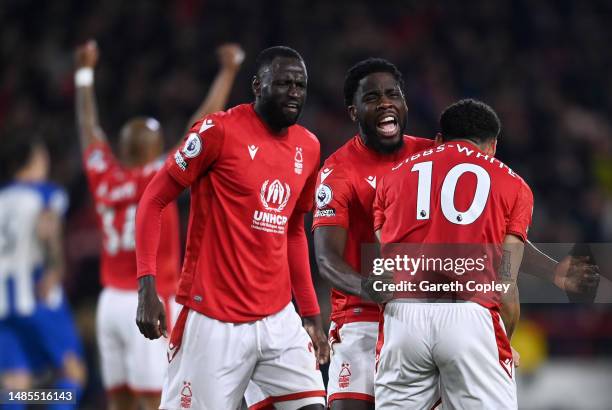 Orel Mangala celebrates with Morgan Gibbs-White and Cheikhou Kouyate of Nottingham Forest following the Premier League match between Nottingham...