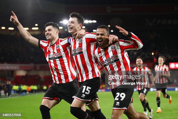 Anel Ahmedhodzic of Sheffield United celebrates with teammates John Egan and Iliman Ndiaye after scoring the team's second goal during the Sky Bet...
