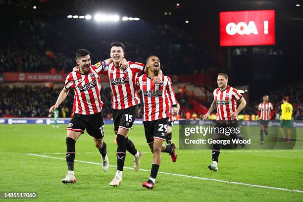 Anel Ahmedhodzic of Sheffield United celebrates with teammates John Egan and Iliman Ndiaye after scoring the team's second goal during the Sky Bet...