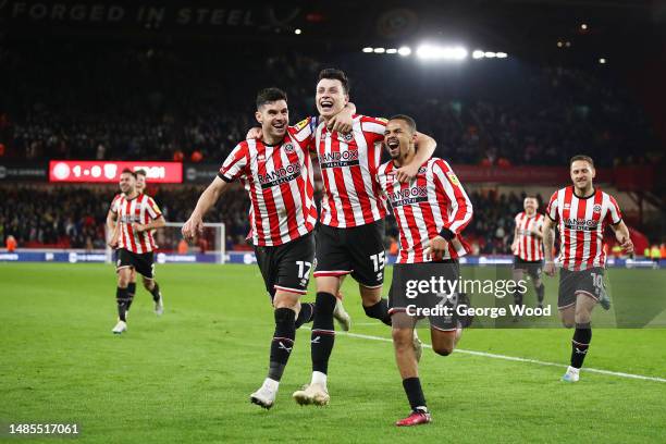 Anel Ahmedhodzic of Sheffield United celebrates with teammates John Egan and Iliman Ndiaye after scoring the team's second goal during the Sky Bet...