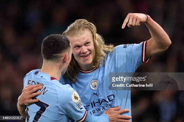 Erling Haaland of Manchester City celebrates with teammate Phil Foden after scoring the team's fourth goal during the Premier League match between...