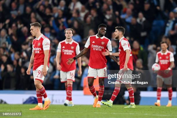 Thomas Partey and Jorginho of Arsenal look dejected after Erling Haaland of Manchester City scored their sides fourth goal during the Premier League...