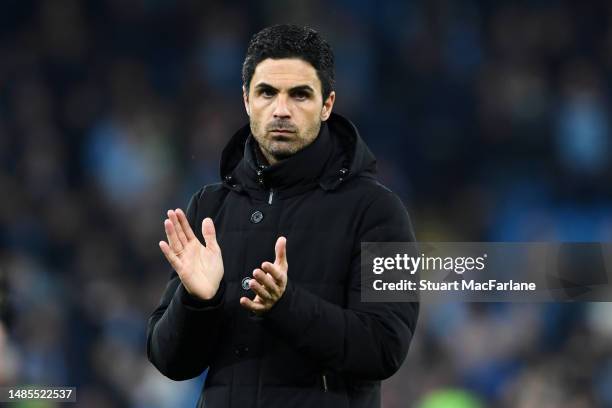 Mikel Arteta, Manager of Arsenal, applauds the fans after the team's defeat in the Premier League match between Manchester City and Arsenal FC at...