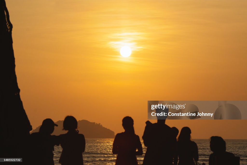 Crowd Silhouettes at Golden Hour. Kota Kinabalu, Sabah Beach Sunset.