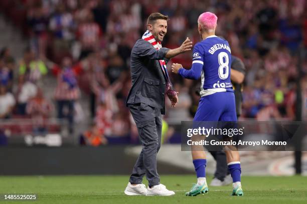 Ex Atletico de Madrid players Gabi clashes hands with Antoine Griezmann during Atletico de Madrid 120 years anniversary after the LaLiga Santander...