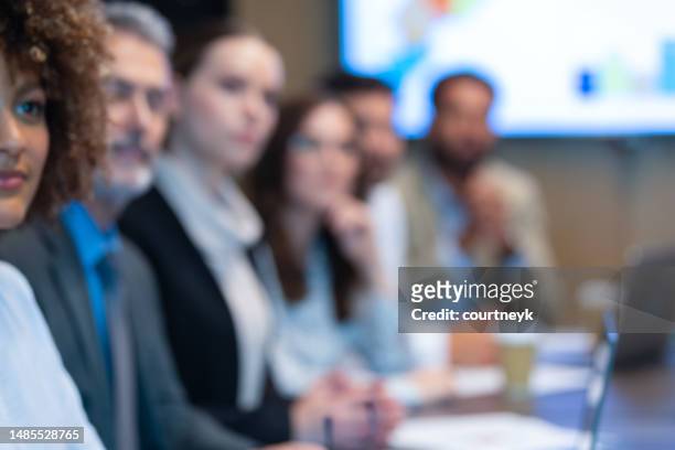 defocussed image group of people listening to a presentation - respect background stock pictures, royalty-free photos & images
