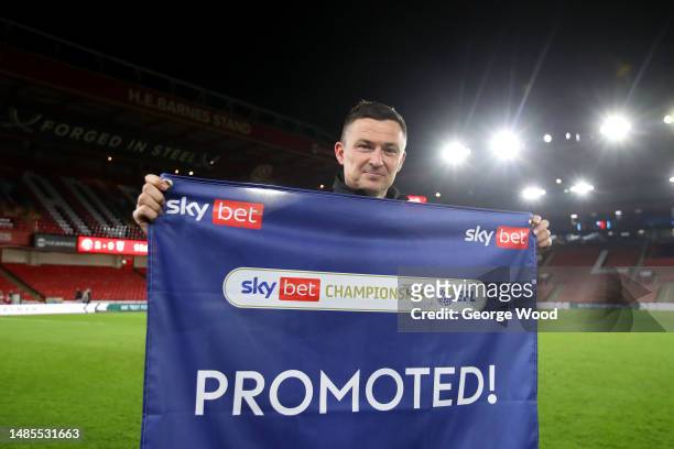 Paul Heckingbottom, Manager of Sheffield United, poses for a photo after winning promotion to the Premier League after the team's victory during the...