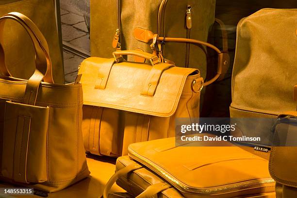 designer leather bags on display in window of store on via mazzini, verona's premier shopping street. - sac photos et images de collection
