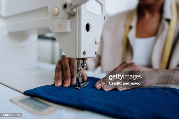 unrecognizable person sewing using sewing machine - sewing stock pictures, royalty-free photos & images