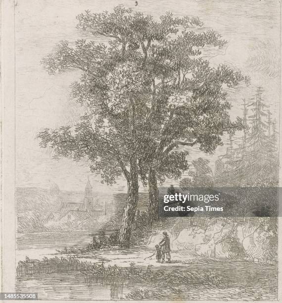 At the edge of a river, a man and a child walk On the right a hill with spruce trees and in the background a village, A man and a child at the...