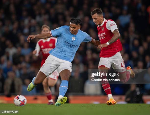 Manuel Akanji of Manchester City and Ben White of Arsenal in action during the Premier League match between Manchester City and Arsenal FC at Etihad...