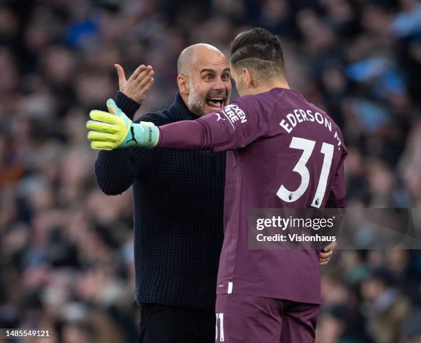 Manchester City manager Pep Guardiola talks to Manchester City goalkeeper Ederson during the Premier League match between Manchester City and Arsenal...