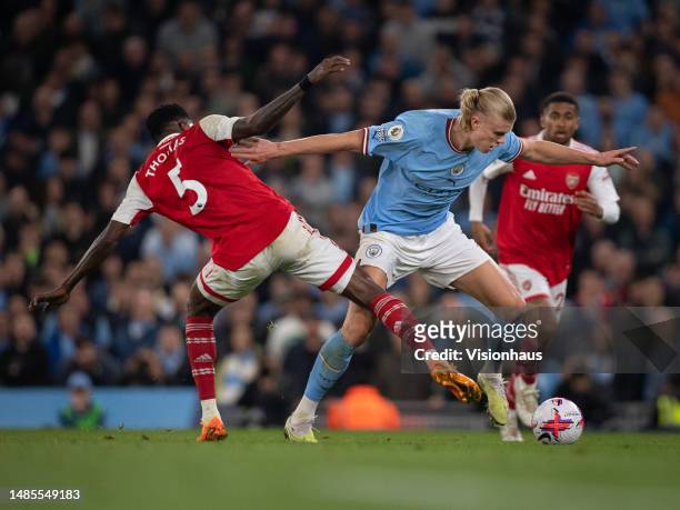 Erling Haaland of Manchester City and Thomas Partey of Arsenal in action during the Premier League match between Manchester City and Arsenal FC at...