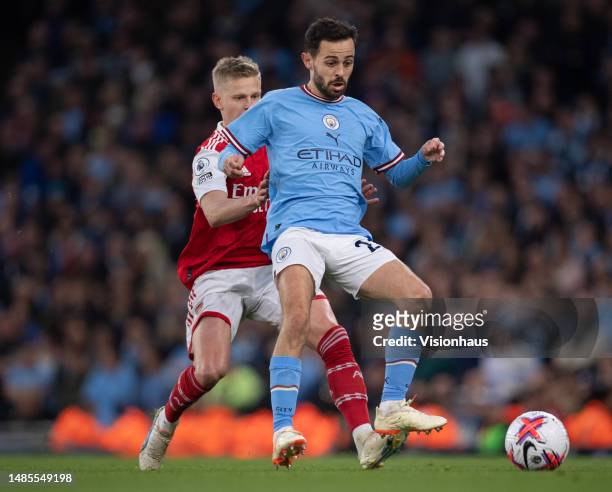 Bernardo Silva of Manchester City and Oleksandr Zinchenko of Arsenal in action during the Premier League match between Manchester City and Arsenal FC...