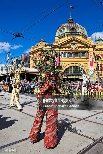 participants in moomba festival parade passing flinders street station. - moomba festival parade stock pictures, royalty-free photos & images