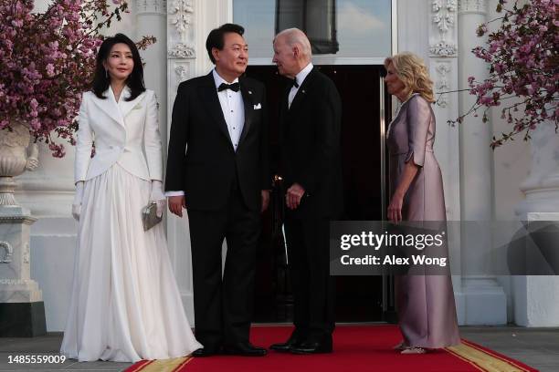 President Joe Biden and first lady Jill Biden welcome South Korean President Yoon Suk Yeol and his wife Kim Keon Hee as they arrive at the North...