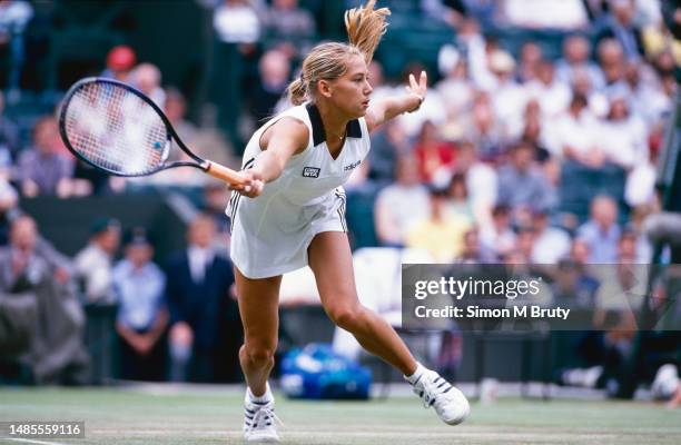 Anna Kournikova of Russia in action during the Women's Singles at The Wimbledon Lawn Tennis Championship at the All England Lawn and Tennis Club at...