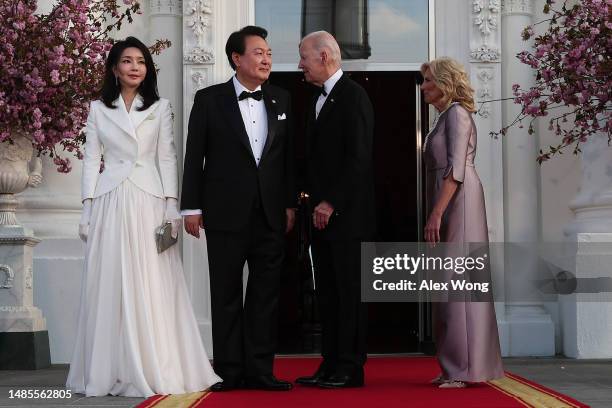 President Joe Biden and first lady Jill Biden welcome South Korean President Yoon Suk Yeol and his wife Kim Keon Hee as they arrive at the North...