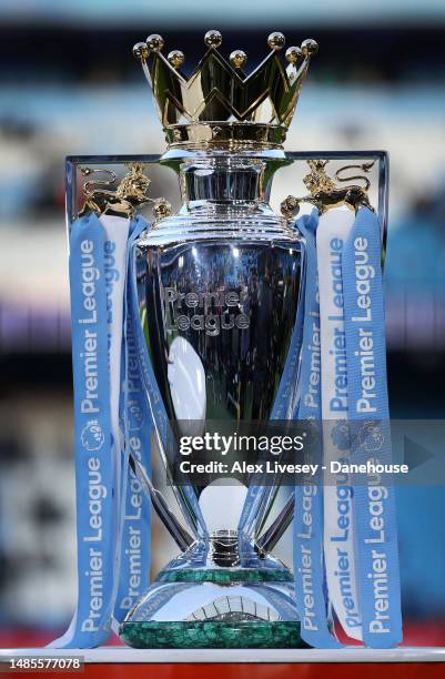 The Premier League trophy is seen prior to the Premier League match between Manchester City and Arsenal FC at Etihad Stadium on April 26, 2023 in...