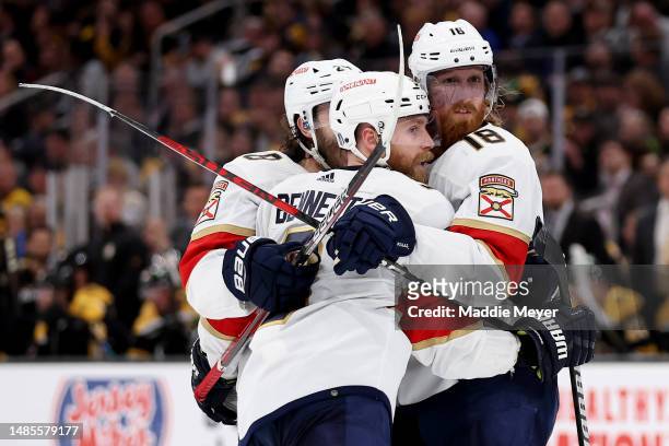 Sam Bennett of the Florida Panthers celebrates with Josh Mahura and Marc Staal after scoring a goal against the Boston Bruins during the second...