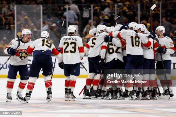 Matthew Tkachuk of the Florida Panthers celebrates with his teammates after scoring the game winning goal against Linus Ullmark of the Boston Bruins...