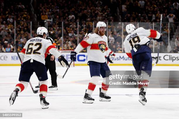 Matthew Tkachuk of the Florida Panthers celebrates with his teammates after scoring the game winning goal against Linus Ullmark of the Boston Bruins...