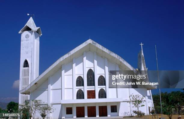 facade and entrance to the cathedral in dili. - dili stockfoto's en -beelden