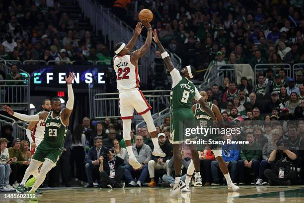 Jimmy Butler of the Miami Heat shoots over Bobby Portis of the Milwaukee Bucks during the first half of Game 5 of the Eastern Conference First Round...