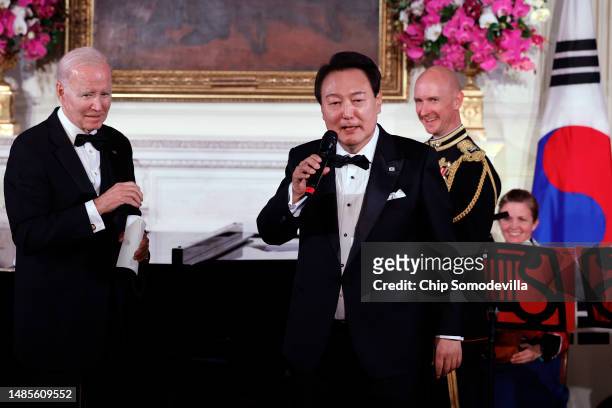 At the behest of U.S. President Joe Biden , South Korean President Yoon Suk-yeol sings "American Pie" during a state dinner in the State Dining Room...