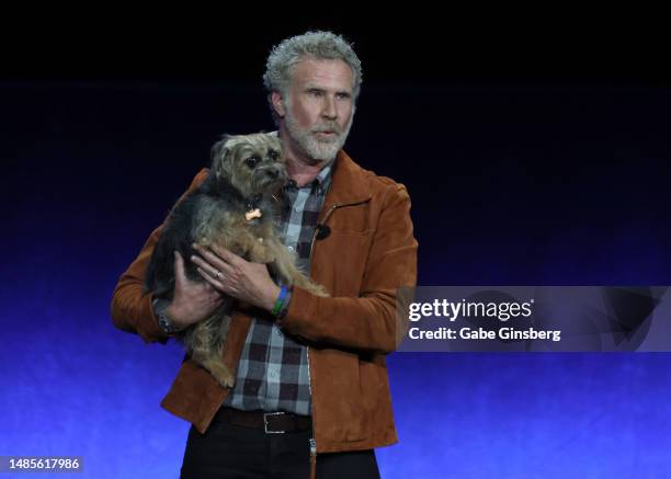 Will Ferrell holds canine cast member Sophie as he speaks onstage to promote the upcoming film "Strays" during the Universal Pictures and Focus...