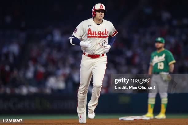 Shohei Ohtani of the Los Angeles Angels rounds the bases on a two-run home run in the eighth inning against the Oakland Athletics at Angel Stadium of...