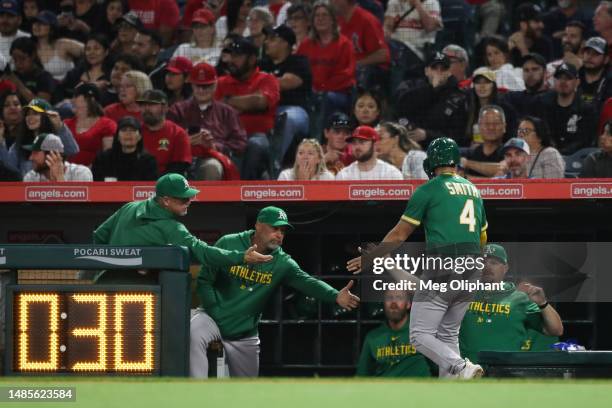 Kevin Smith of the Oakland Athletics celebrates scoring in the fifth inning against the Los Angeles Angels at Angel Stadium of Anaheim on April 26,...