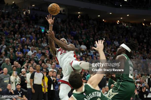 Jimmy Butler of the Miami Heat shoots over Pat Connaughton of the Milwaukee Bucks as time expires in regulation of Game 5 of the Eastern Conference...