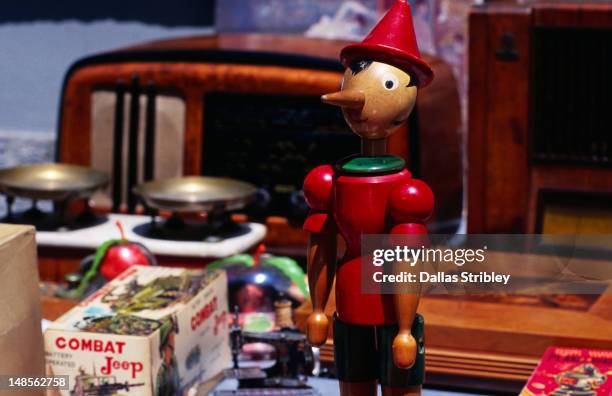 pinocchio for sale at ripa di porta ticinese market. - tiny pinocchio stock pictures, royalty-free photos & images