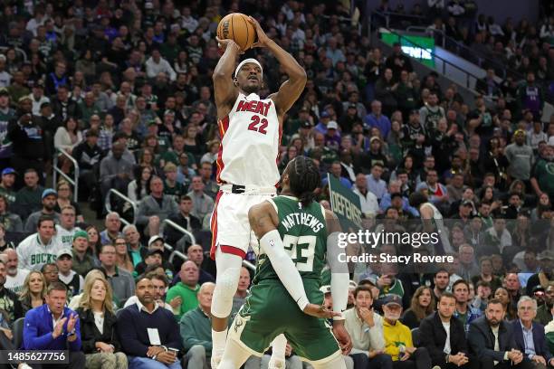 Jimmy Butler of the Miami Heat shoots over Wesley Matthews of the Milwaukee Bucks during the second half of Game 5 of the Eastern Conference First...
