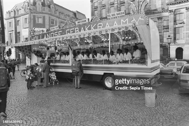 Immediately after Christmas, sales of oliebollen started on Saturday, oliebollen stall on Dam Square in Amsterdam, December 27 OLIEBOLLEN, Christmas,...