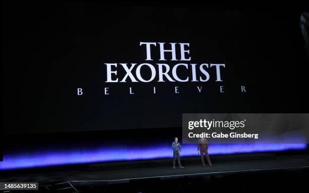 David Gordon Green and Jason Blum speak onstage as they promote the upcoming film "The Exorcist: Believer" during the Universal Pictures and Focus...