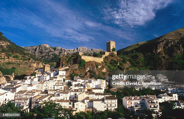 overloooking the whitewashed village buildings with castillo de la yedra in the background. - cazorla stock pictures, royalty-free photos & images