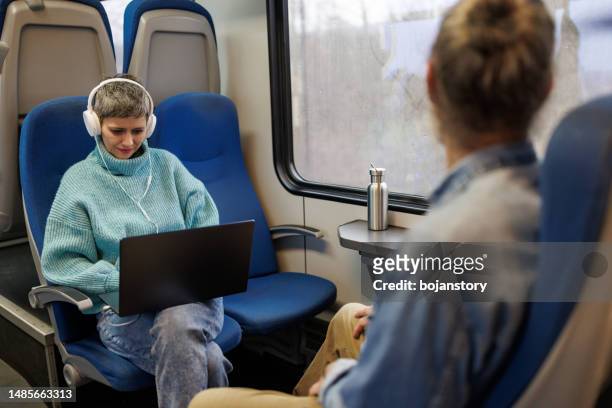 enjoying journey - working on laptop in train top view imagens e fotografias de stock
