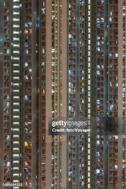 crowded city apartment building illuminated close up hong kong china - kowloon walled city stock pictures, royalty-free photos & images