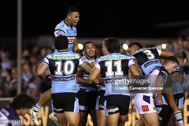 Sione Katoa of the Sharks celebrates with team mates after scoring a try during the round nine NRL match between Cronulla Sharks and North Queensland...