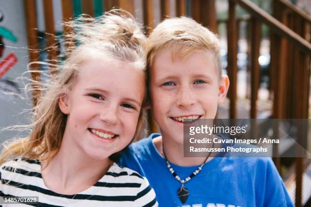 friendship together tween kids smile happy at playground in summer - いとこ ストックフォトと画像