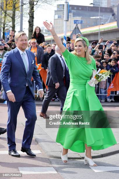 King Willem-Alexander of The Netherlands and Queen Maxima of The Netherlands wave to the public during Kingsday celebrations on April 27, 2023 in...