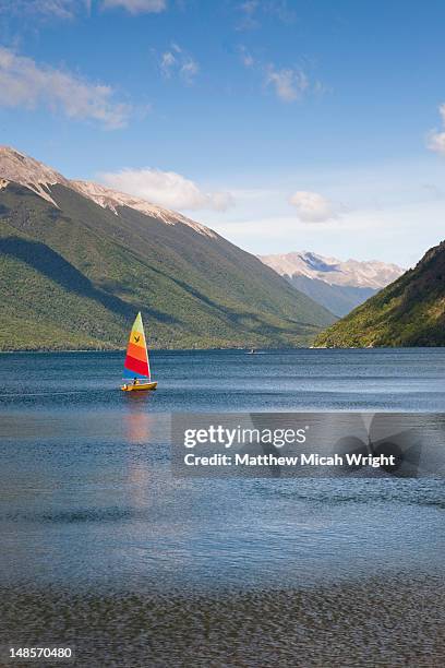 lake rotoiti is lake in the tasman region of new zealand. it is a mountain lake within in the nelson lakes national park. sailing is a popluar activity on this lake - nelson lakes national park stock pictures, royalty-free photos & images