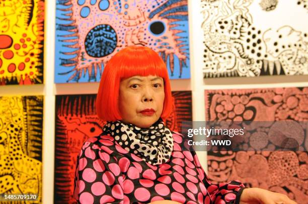 Japanese artist Yayoi Kusama at her Whitney Museum of American Art restrospective exhibit. Kusama wears Louis Vuitton.