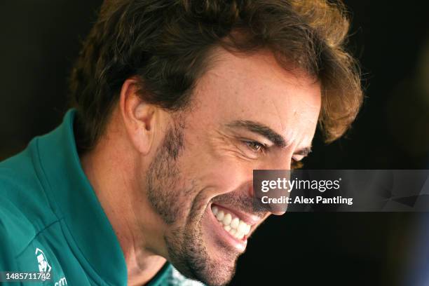 Fernando Alonso of Spain and Aston Martin F1 Team looks on in the Paddock during previews ahead of the F1 Grand Prix of Azerbaijan at Baku City...