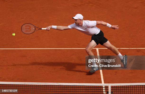 Kyle Edmund of Great Britain stretches to play a forehand volley against Dominic Thiem of Austria during their first round match on day four of the...